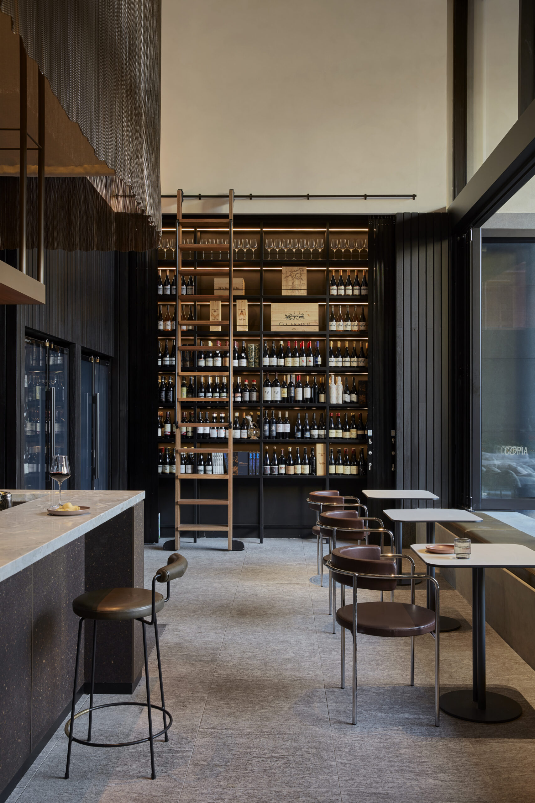 Image of COPIA's Wine Wall, with a seating.